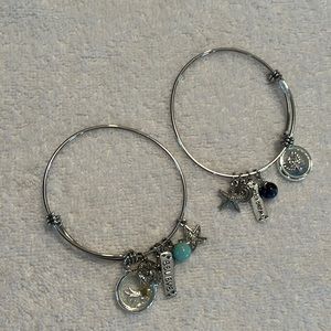 Silver toned bracelets with charms